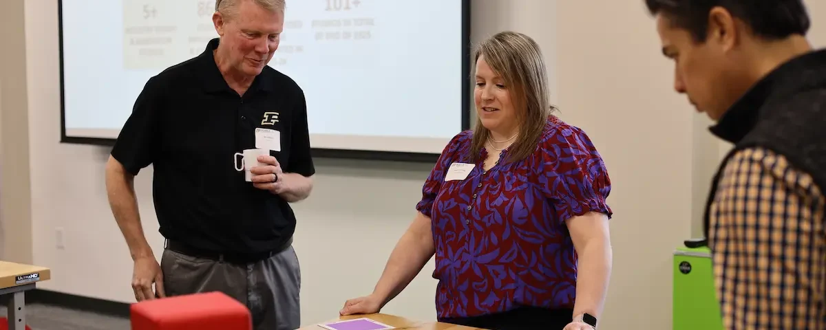 People participate in STEM professional development with STEM Education Works.