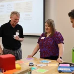 People participate in STEM professional development with STEM Education Works.