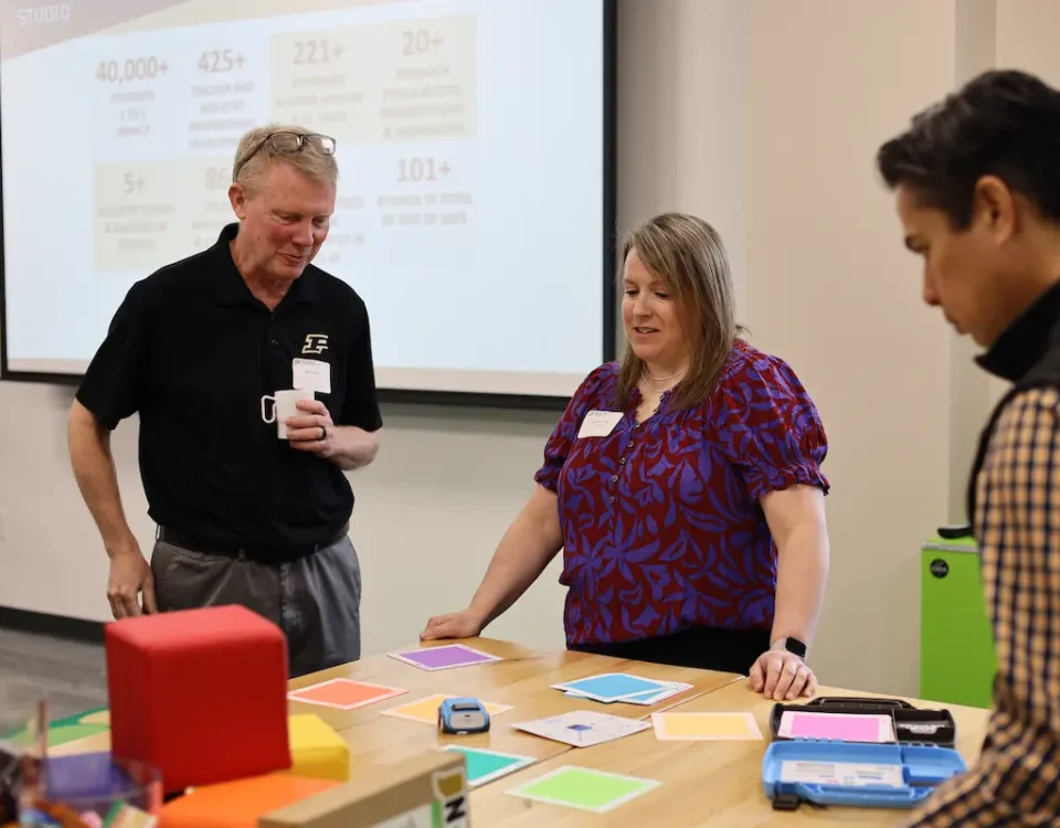 People participate in STEM professional development with STEM Education Works.