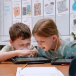Kids explore YouTube Channels during a STEM education lesson.