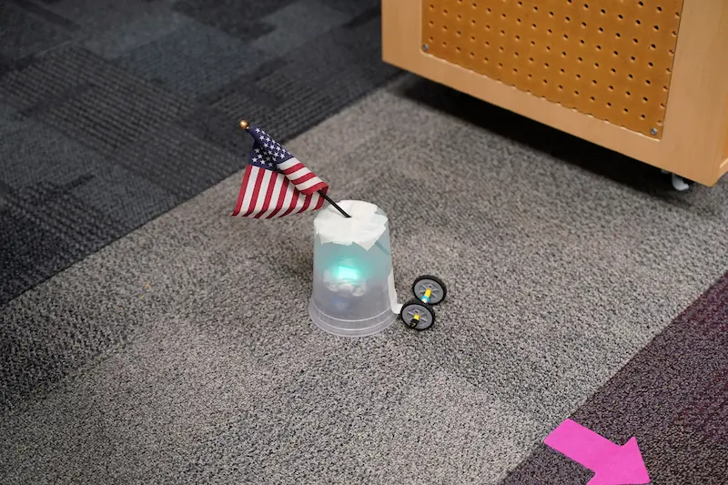 Adding decorations to robots and other STEM creations during a STEM summer camp