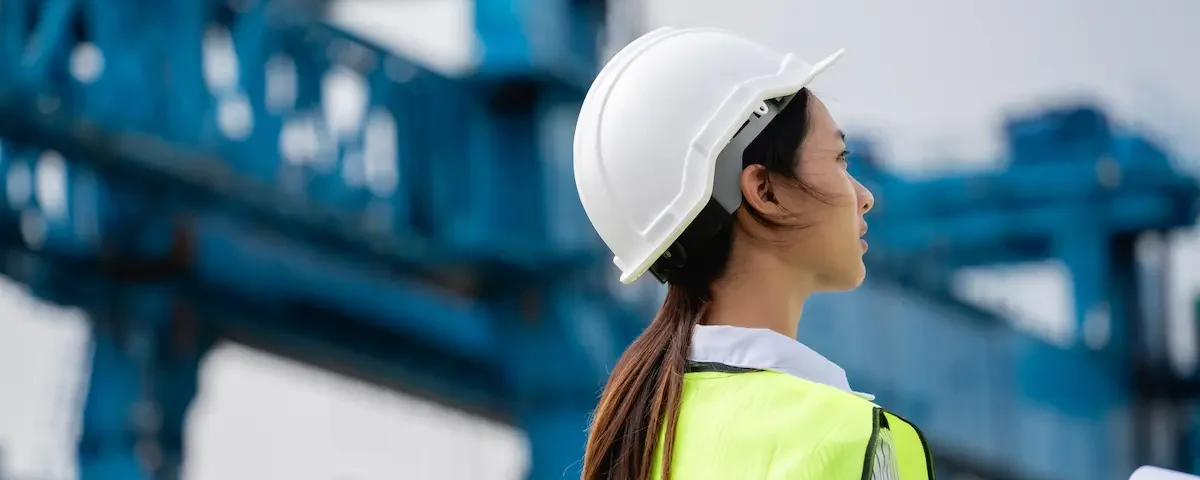 A female civil engineer works to design a safe bridge.