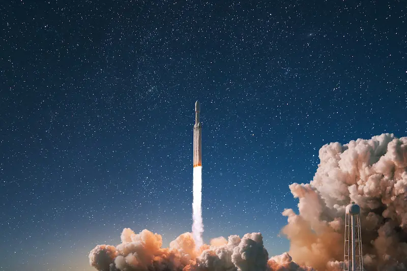  New modern rocket with smoke and blast successfully lift off into the starry sky

