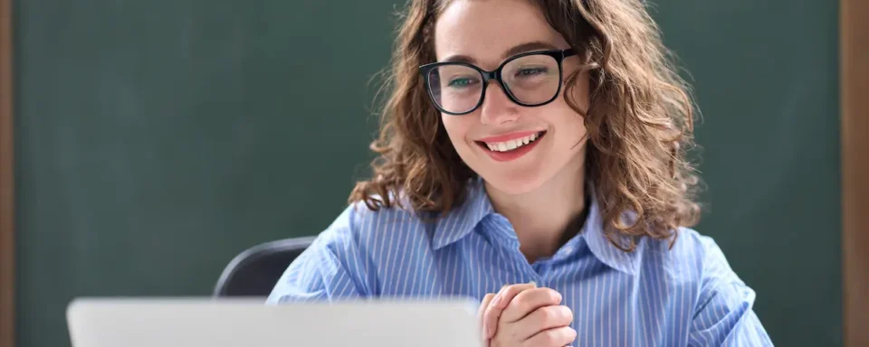 Teacher smiles after being approved for a grant.