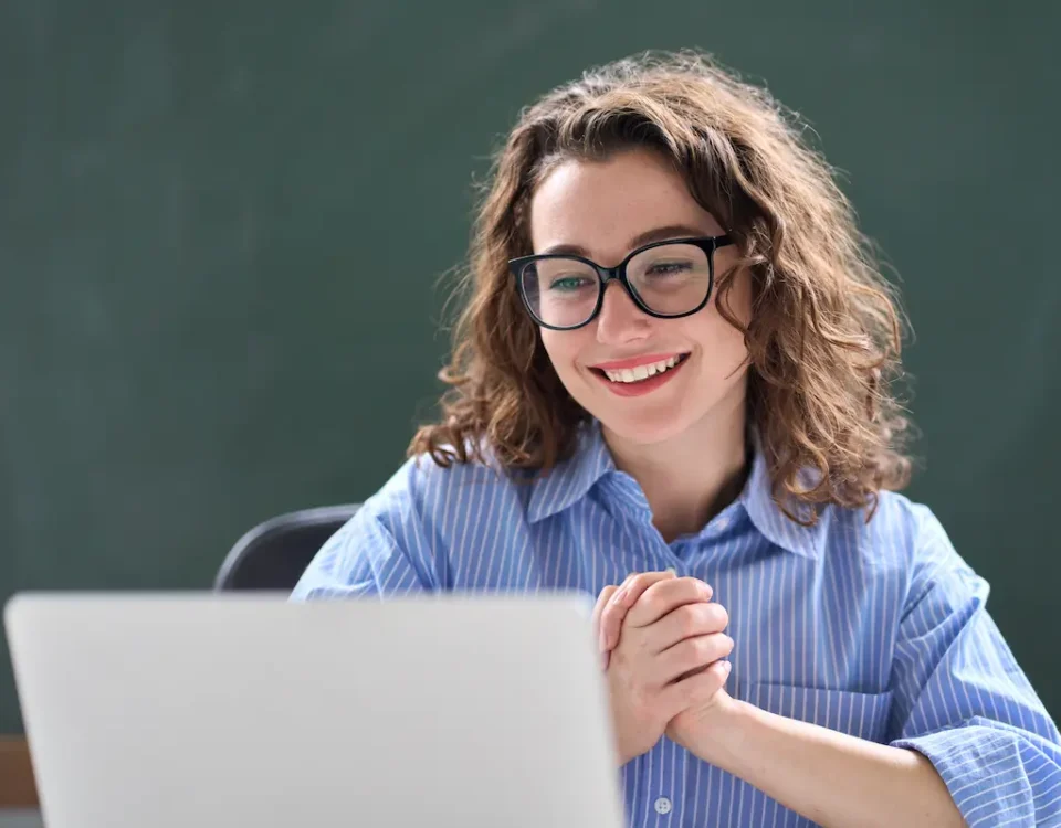Teacher smiles after being approved for a grant.