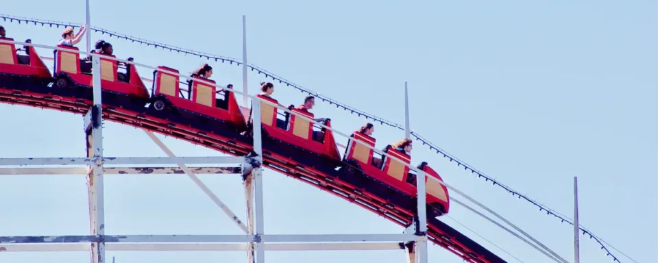 A roller coaster whirs by on National Roller Coaster Day.
