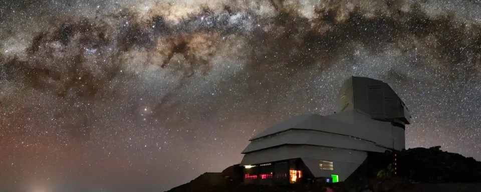 The Vera C. Rubin Observatory against the night sky.