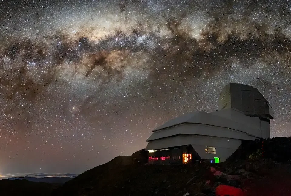 The Vera C. Rubin Observatory against the night sky.