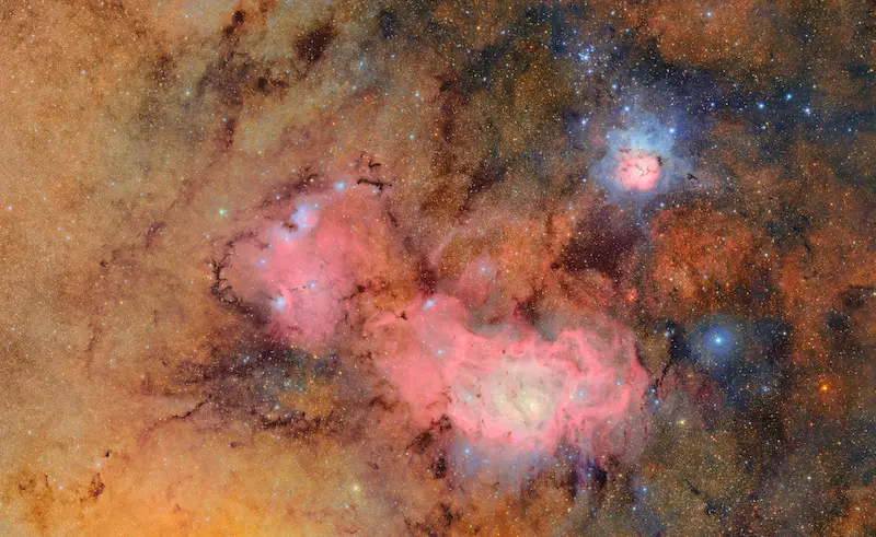 the Trifid and Lagoon nebulae, a star-forming region around 9,000 lightyears from Earth. 