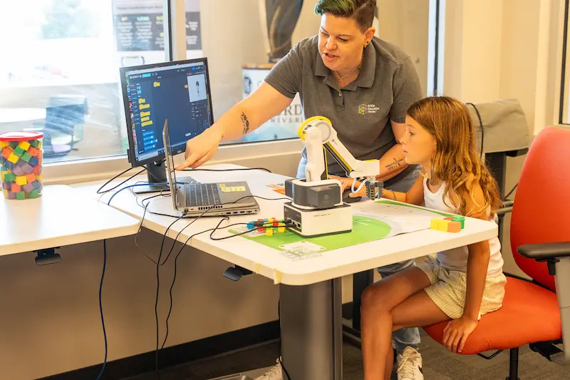Student gets a hands-on robotics lesson in the classroom. 