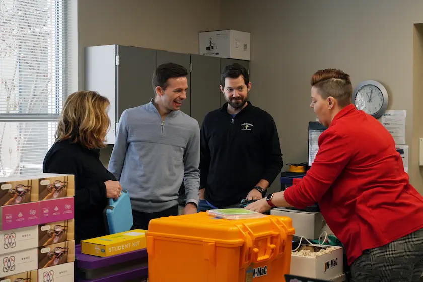 A STEM Education Works team member helping instructors with professional development