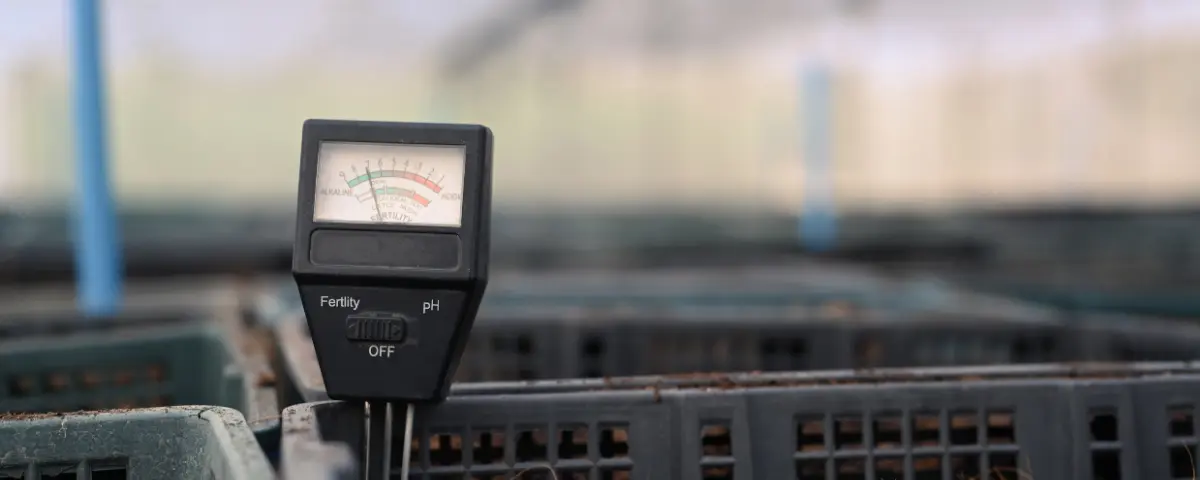 Close up view of soil meter for measured pH and moisture in greenhouse.