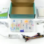 Elecfreaks micro:bit Starter Kit with all the components taken out of the box, including an instructional booklet, breadboard, adapter, jumper wires, LED lights, cables, and more.