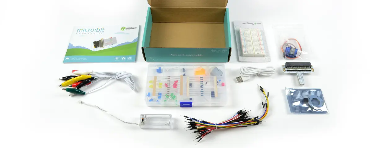 Elecfreaks micro:bit Starter Kit with all the components taken out of the box, including an instructional booklet, breadboard, adapter, jumper wires, LED lights, cables, and more.