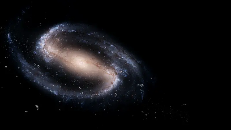 This image features a galaxy set against the blackness of space. The galaxy is a swirling mass of stars and cosmic dust.