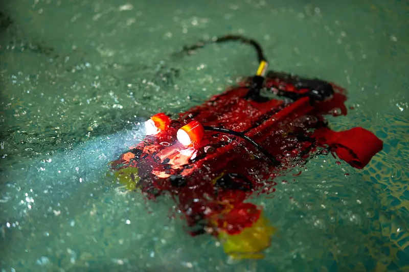 Remote-operated vehicle exploring an underwater environment.