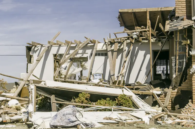 An abandoned house in shambles after a severe earthquake.