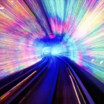 An underground subway tunnel filled with streaks of multicolored light.