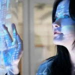 Woman interacting with a blue holographic screen.