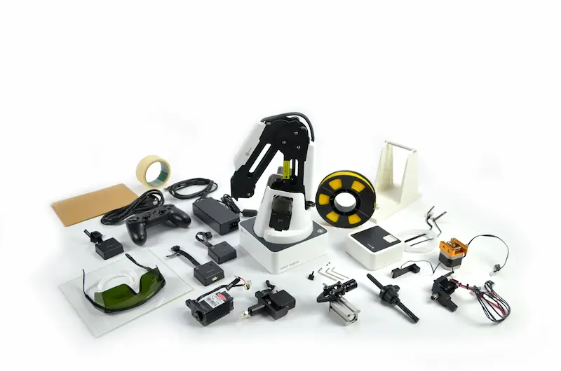 Dobot Magician with all five end effectors, cords, power pack, and other accessories.