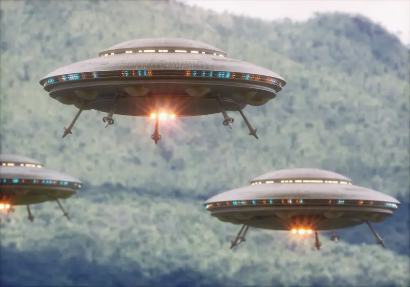 Flying saucers in the sky over a forest.