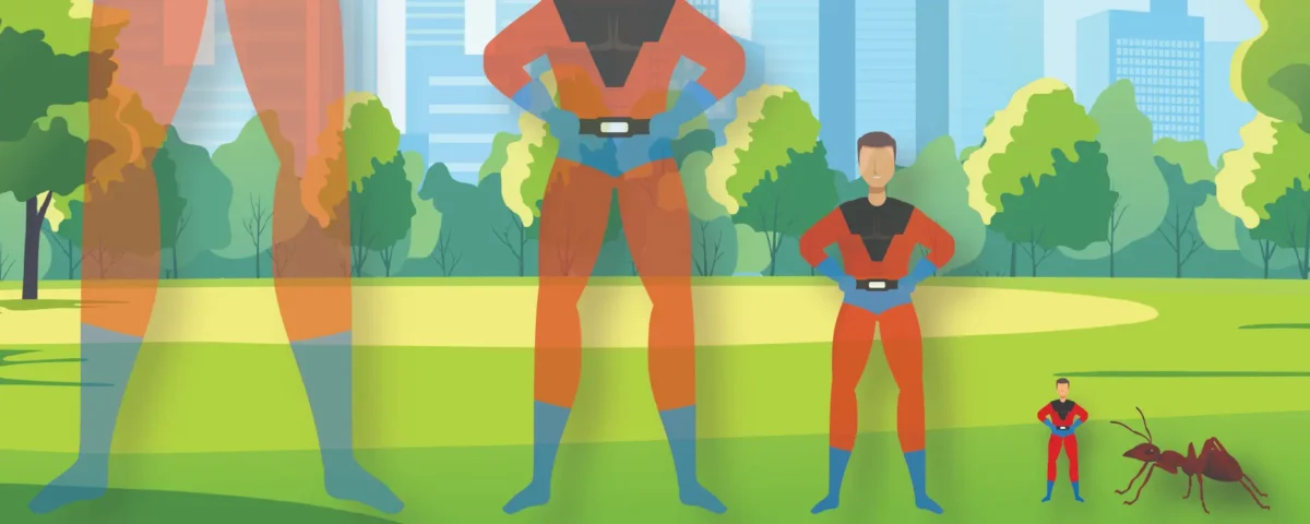 Silhouette of a superhero wearing a cape slowly getting smaller in front of a background of any on the ground.